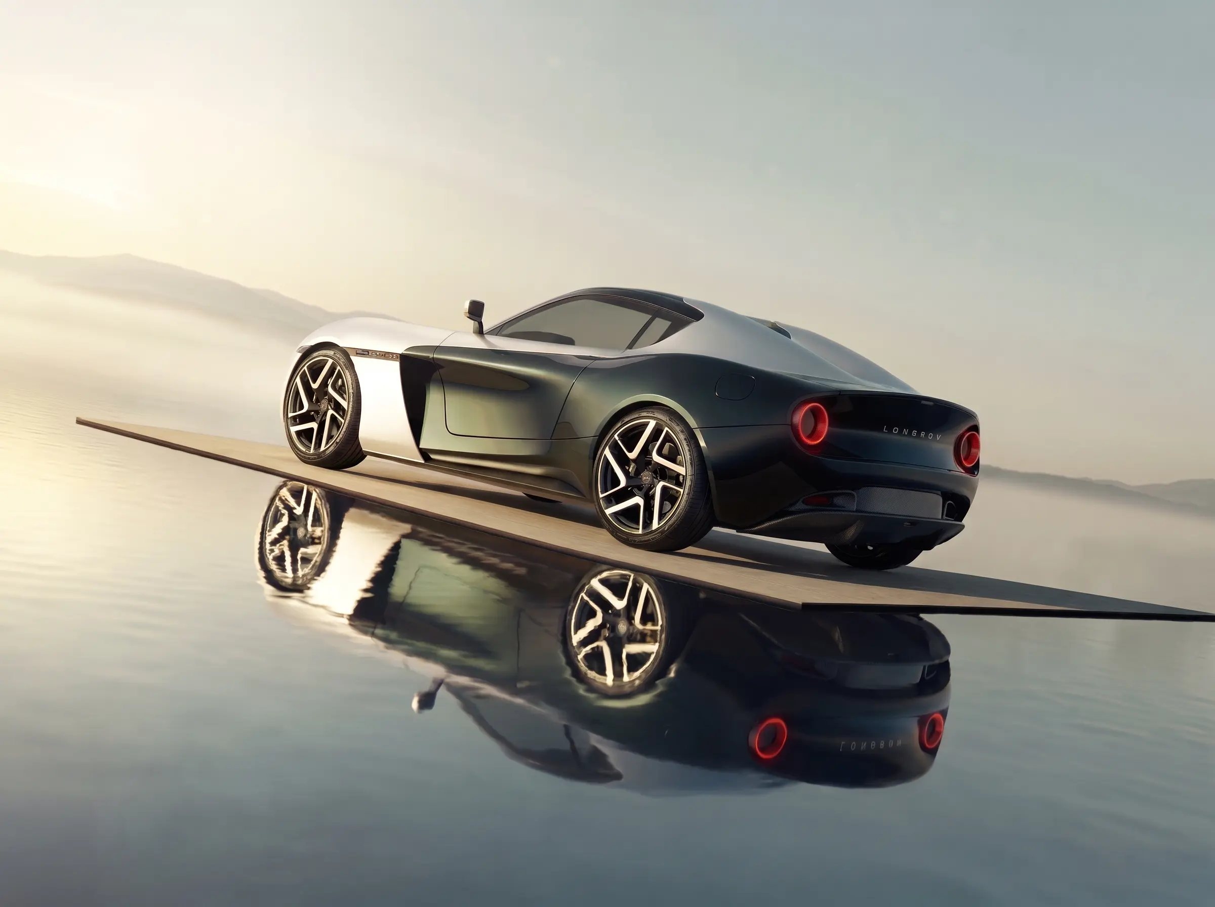 Roadster on a narrow causeway over still water at first light, fully reflected beneath